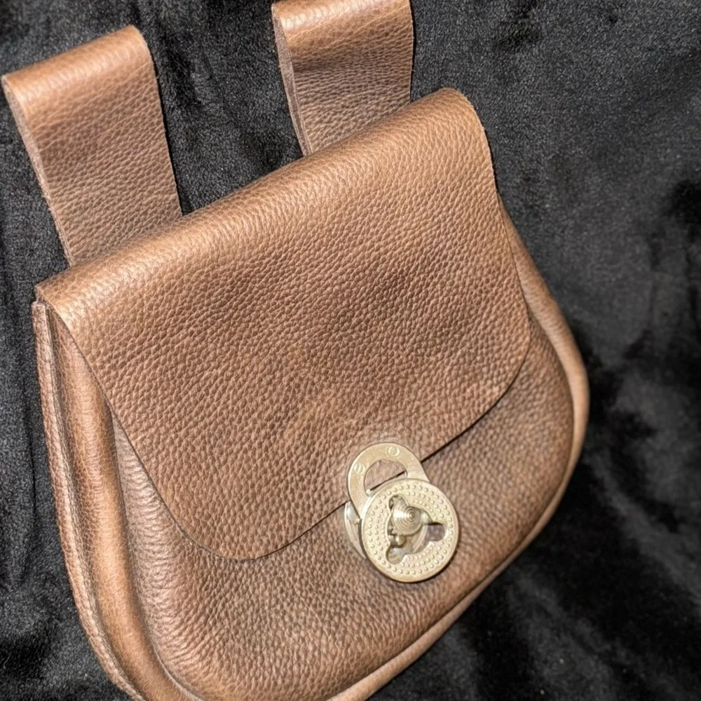 Brown Leather Backpack with Classic Design and Flap Closure
